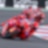 Superbike y piloto de Ducati corriendo por una curva de la pista