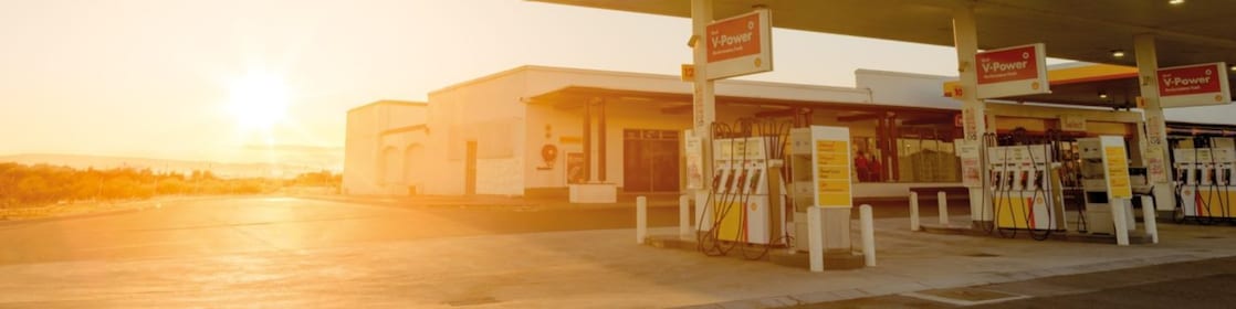The forecourt of a shell service station at dusk